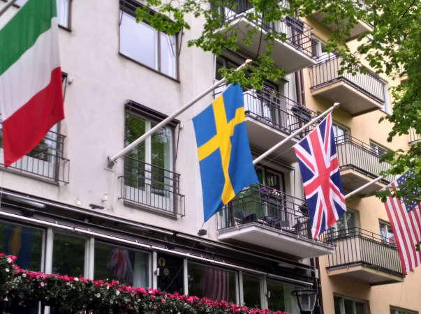 Italian, Sweedish, British and American flags around balconies